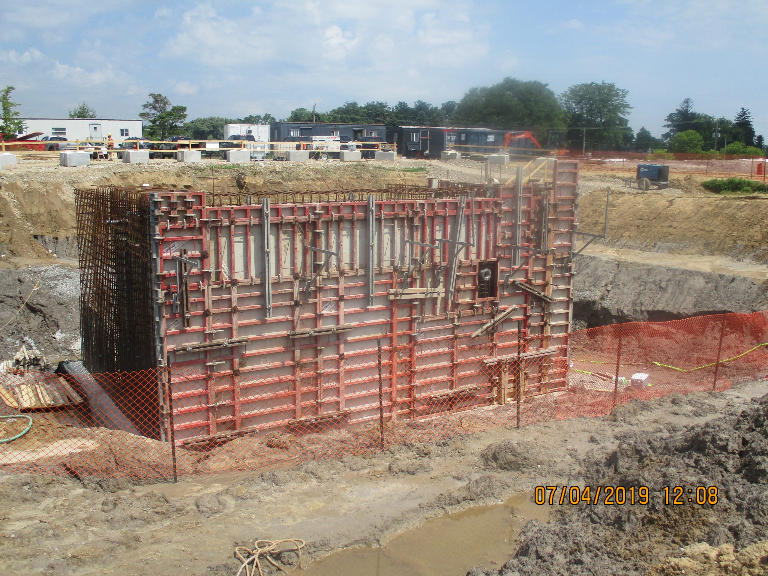 A construction site showcasing various building materials and equipment.